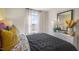 Comfortable bedroom featuring a cozy bed, bedside table, and ample natural light at 2156 Monk Dr, Haw River, NC 27258