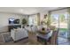 Well-lit dining area adjacent to living room and kitchen is the ideal space for Gathering meals at 2156 Monk Dr, Haw River, NC 27258