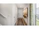 Welcoming entryway showcases neutral colors, wood flooring, and plenty of natural light at 2156 Monk Dr, Haw River, NC 27258