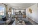 Bright, open-concept living room seamlessly flows into kitchen and dining area for easy entertaining at 2156 Monk Dr, Haw River, NC 27258