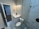 Elegant bathroom features a glass shower with white marble tiling, and a white vanity with modern fixtures at 223 E Nash St, Spring Hope, NC 27882