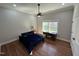 Charming bedroom with hardwood floors, a fan, and a bright window at 223 E Nash St, Spring Hope, NC 27882