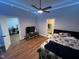 Well lit bedroom with hardwood floors and ensuite access at 223 E Nash St, Spring Hope, NC 27882