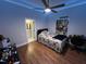 Modern bedroom with hardwood floors, decor, and ensuite bathroom at 223 E Nash St, Spring Hope, NC 27882