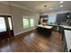 Spacious kitchen features a center island with seating, stainless steel appliances, and gray cabinetry at 223 E Nash St, Spring Hope, NC 27882