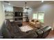 Comfortable living room with a stone fireplace, built-in shelves, and a spacious seating area at 223 E Nash St, Spring Hope, NC 27882