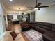 An open concept kitchen flows to the living area with a modern island, fireplace and comfortable seating at 223 E Nash St, Spring Hope, NC 27882