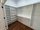 Large walk-in closet with built-in shelving and hanging rods, perfect for organization at 223 E Nash St, Spring Hope, NC 27882
