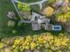 Bird's eye view of a beautiful property featuring a pool, patio, and well-manicured lawn at 2259 Helena Moriah Rd, Timberlake, NC 27583