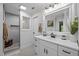 Bathroom featuring a walk-in shower, white vanity, and modern fixtures at 2259 Helena Moriah Rd, Timberlake, NC 27583