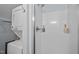 Bathroom features a stacked washer and dryer next to the shower at 2259 Helena Moriah Rd, Timberlake, NC 27583