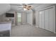 Neutral bedroom featuring plush carpet, bright natural light, and built in closet storage at 2259 Helena Moriah Rd, Timberlake, NC 27583