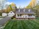 Charming home features a covered porch, dormer windows, and well-maintained landscaping at 2259 Helena Moriah Rd, Timberlake, NC 27583