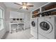 Laundry room equipped with washer, dryer, cabinets, and folding area at 2259 Helena Moriah Rd, Timberlake, NC 27583