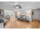 Open-concept living room with hardwood floors, ceiling fan, and neutral decor at 2259 Helena Moriah Rd, Timberlake, NC 27583