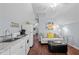 Open floor plan with a kitchenette and cozy living area, featuring a light-filled interior at 2259 Helena Moriah Rd, Timberlake, NC 27583