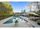 Inviting in-ground pool with lounge seating and umbrella, perfect for outdoor relaxation at 2259 Helena Moriah Rd, Timberlake, NC 27583