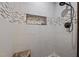 Walk-in shower featuring decorative tile and recessed shelving at 2259 Helena Moriah Rd, Timberlake, NC 27583