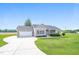 Charming single-story home featuring a manicured lawn, attached garage, and traditional architectural details at 24 Cider Ct, Benson, NC 27504