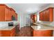 Updated kitchen features modern appliances, granite countertops, and hardwood floors at 24 Cider Ct, Benson, NC 27504
