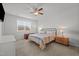 Well-lit bedroom with a ceiling fan, a cozy bed, and neutral decor at 252 Tyree Trl, Burlington, NC 27215