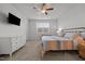 Cozy bedroom featuring a comfortable bed, ceiling fan, and bright natural light at 252 Tyree Trl, Burlington, NC 27215