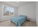 Bright bedroom featuring a queen bed next to a bright window at 252 Tyree Trl, Burlington, NC 27215
