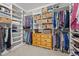 Organized walk-in closet with shelving, hanging racks, and dresser at 252 Tyree Trl, Burlington, NC 27215