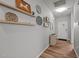 Bright entryway features wood-look flooring, decorative shelves, and a view of the front door at 252 Tyree Trl, Burlington, NC 27215