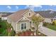 Aerial view of a home with lush landscaping, a two-car garage, and a well-maintained lawn at 252 Tyree Trl, Burlington, NC 27215