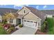 Home featuring a two-car garage, manicured landscaping, and a decorative exterior at 252 Tyree Trl, Burlington, NC 27215