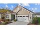 Charming home exterior with a two-car garage, well-manicured landscaping and an American flag at 252 Tyree Trl, Burlington, NC 27215