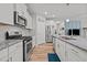 Spacious kitchen with stainless steel appliances, granite countertops, and a center island at 252 Tyree Trl, Burlington, NC 27215