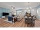 Open living space with fireplace, wood-look floors and natural lighting at 252 Tyree Trl, Burlington, NC 27215