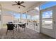 Cozy screened porch with a table and chairs overlooking the outdoor patio at 252 Tyree Trl, Burlington, NC 27215