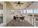 Cozy screened porch features a ceiling fan and a table with four chairs at 252 Tyree Trl, Burlington, NC 27215