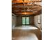 Unfinished basement with an exterior door and window at 2720 Townedge Ct, Raleigh, NC 27612