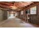 Spacious unfinished basement with exposed rafters and block walls, offering potential at 2720 Townedge Ct, Raleigh, NC 27612