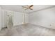 Bright bedroom featuring a ceiling fan and a walk-in closet for plenty of storage space at 2720 Townedge Ct, Raleigh, NC 27612