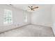 Bedroom featuring carpeted floors, two windows and ceiling fan at 2720 Townedge Ct, Raleigh, NC 27612