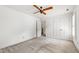 Bright bedroom featuring a ceiling fan and closet for plenty of storage space at 2720 Townedge Ct, Raleigh, NC 27612