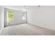Bright, spacious bedroom featuring natural light from large windows with plush carpeting at 2720 Townedge Ct, Raleigh, NC 27612
