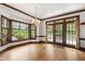 Dining Room with hardwood floors, large windows, and adjacent access to outdoors at 2720 Townedge Ct, Raleigh, NC 27612