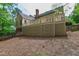 The house features a spacious deck, perfect for outdoor entertaining, as seen from the backyard at 2720 Townedge Ct, Raleigh, NC 27612