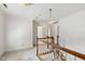 Upstairs hallway with carpeted floor and wood railing leading to the top level at 2720 Townedge Ct, Raleigh, NC 27612