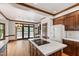 Bright eat-in kitchen with wooden cabinets, center island, stainless appliances, and hardwood flooring at 2720 Townedge Ct, Raleigh, NC 27612