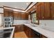 Classic kitchen features custom wood cabinets, marble counters, stainless appliances, and hardwood flooring at 2720 Townedge Ct, Raleigh, NC 27612