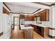 Traditional kitchen featuring custom wood cabinets, center island with marble counters, and stainless appliances at 2720 Townedge Ct, Raleigh, NC 27612