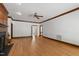 Bright living room with hardwood floors, white walls, and elegant trim at 2720 Townedge Ct, Raleigh, NC 27612