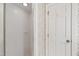 Tiled shower with glass door adjacent to the doorway in the bathroom at 2720 Townedge Ct, Raleigh, NC 27612